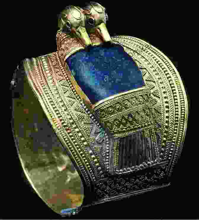 A Golden Amulet With Intricate Carvings, Adorned With Gemstones The Treasure Man Joy Vee